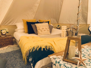 Bed in glamping tent